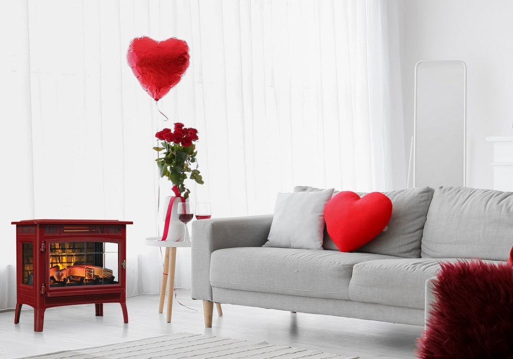A red electric fireplace sits in a Valentine's Day themed white room