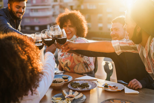 Friends enjoying wine on the balcony for feature image