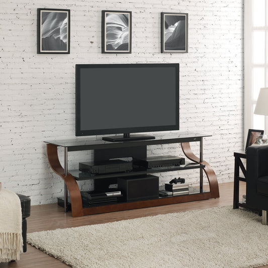 Modern living room with a TV on a wooden stand against a white brick wall.
