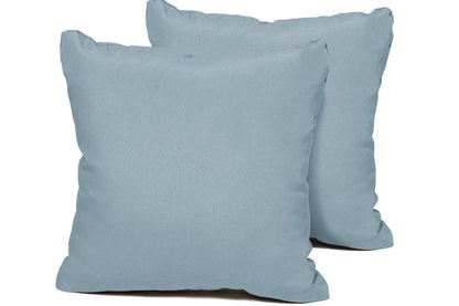 Two light blue pillows on a white background