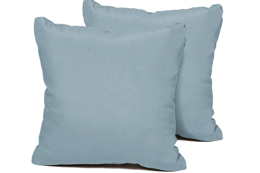Two light blue pillows on a white background
