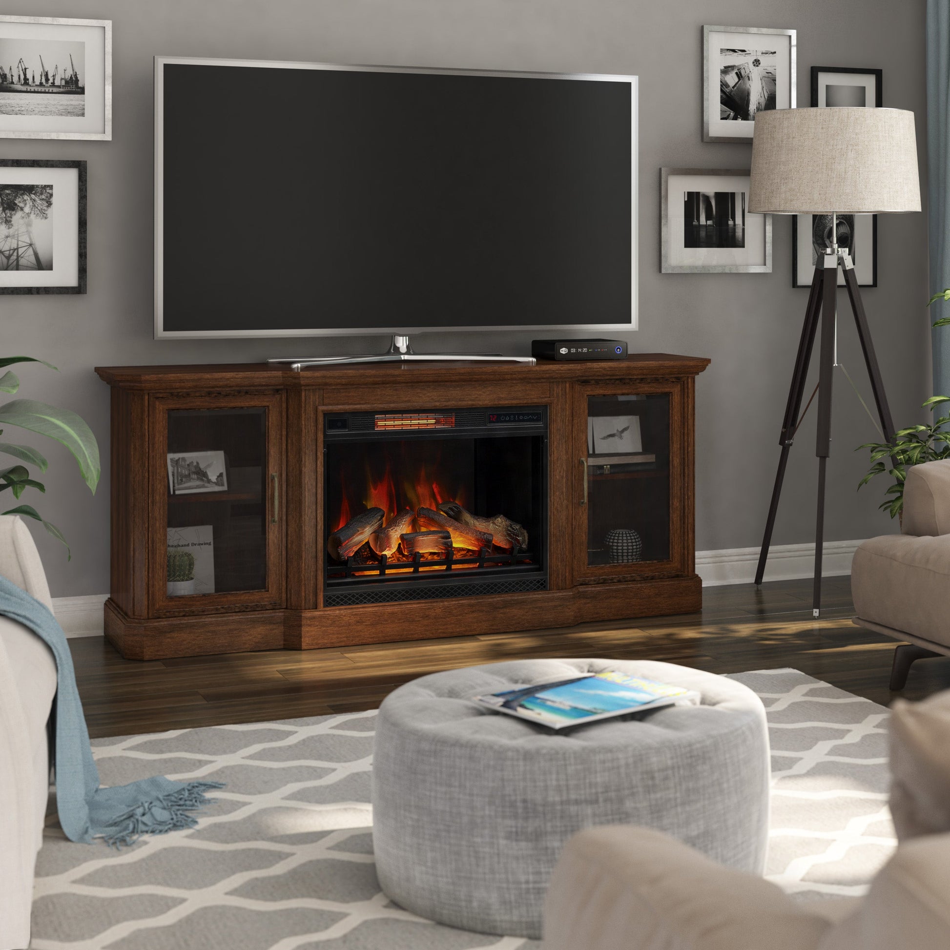 Living room with a wooden TV stand featuring a fireplace, television, and decor.