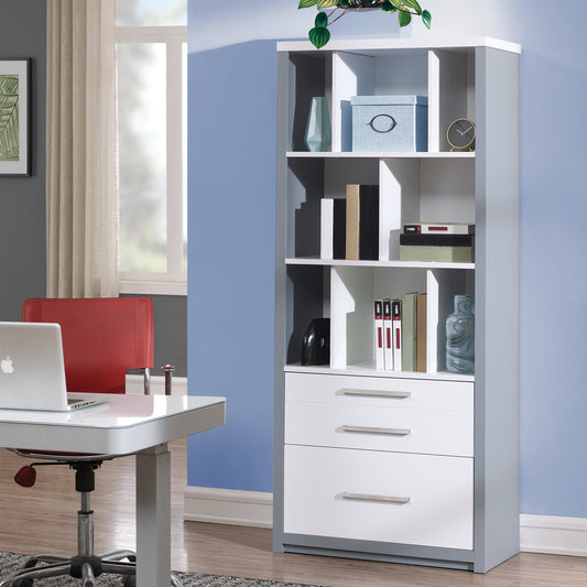 White bookshelf with shelves and drawers in a room with a desk and chair.