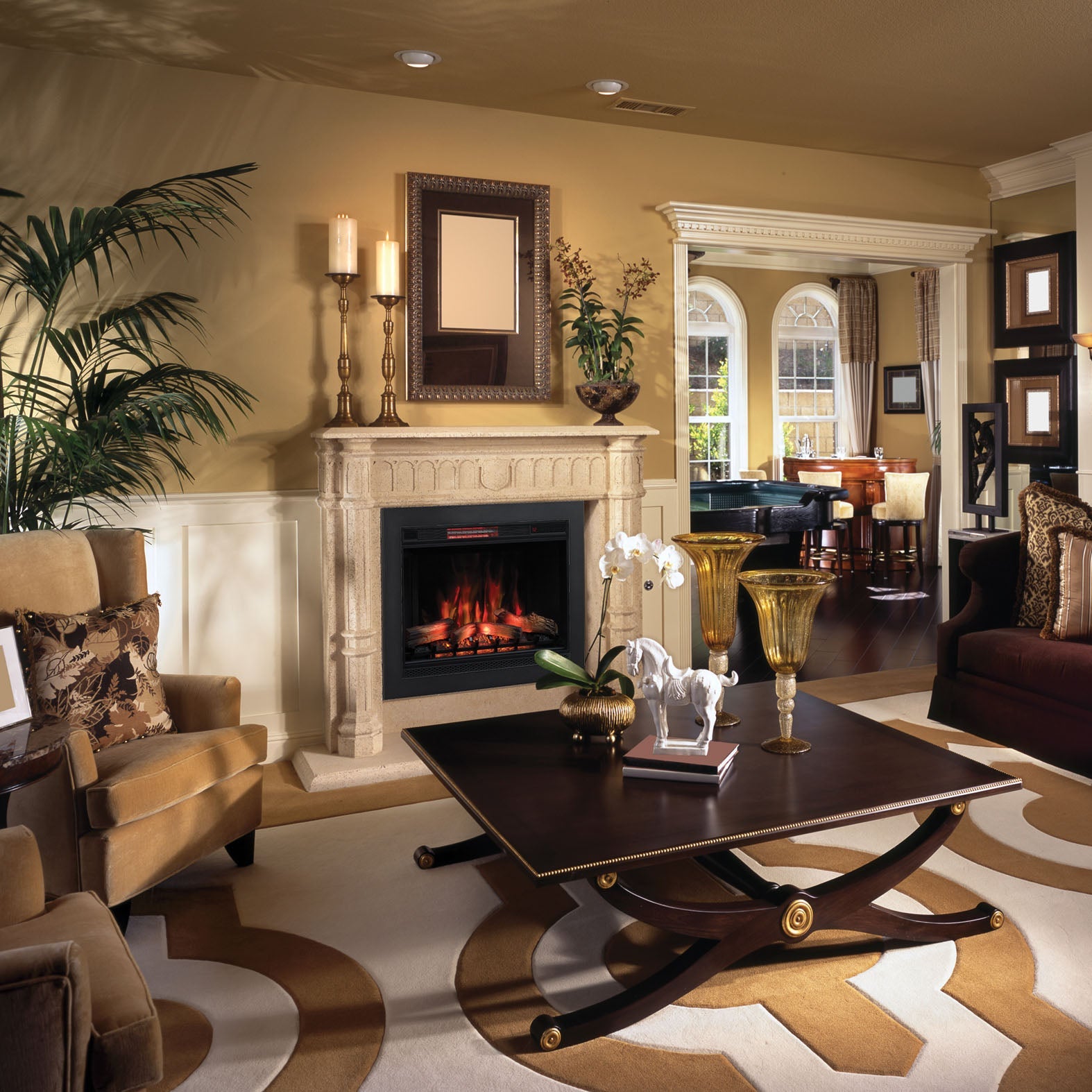 Luxurious living room with fireplace, sofa, and decorative items.