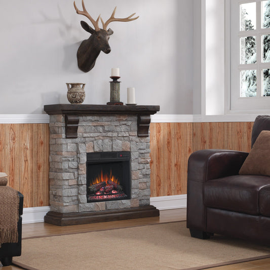 Living room with stone fireplace, leather sofa, and deer head mount.
